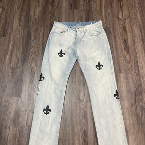 Stylish Light Blue Jeans with Black Fleur-de-Lis Negotiable